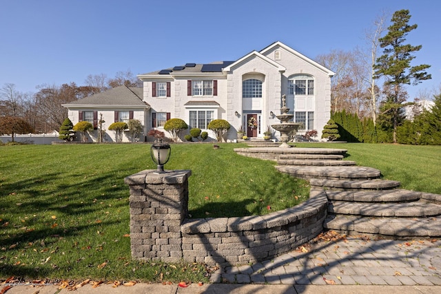 view of front of property featuring a front yard