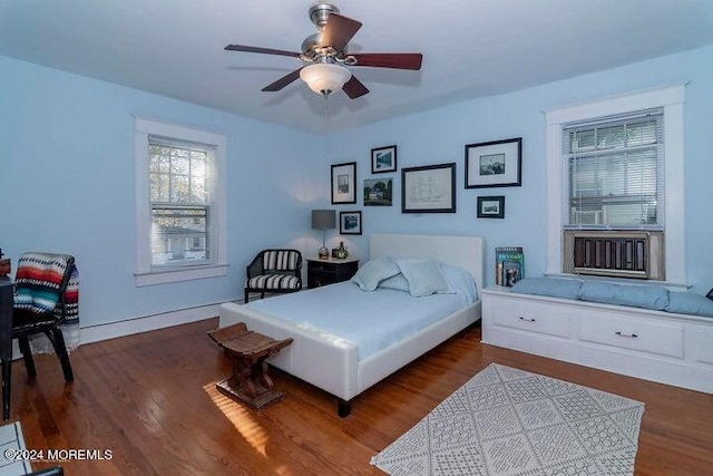 bedroom featuring dark hardwood / wood-style floors and ceiling fan