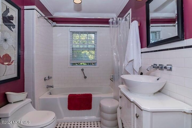 full bathroom with tile walls, vanity, ornamental molding, toilet, and shower / bath combo with shower curtain