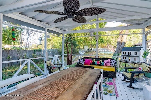 sunroom / solarium with vaulted ceiling and ceiling fan