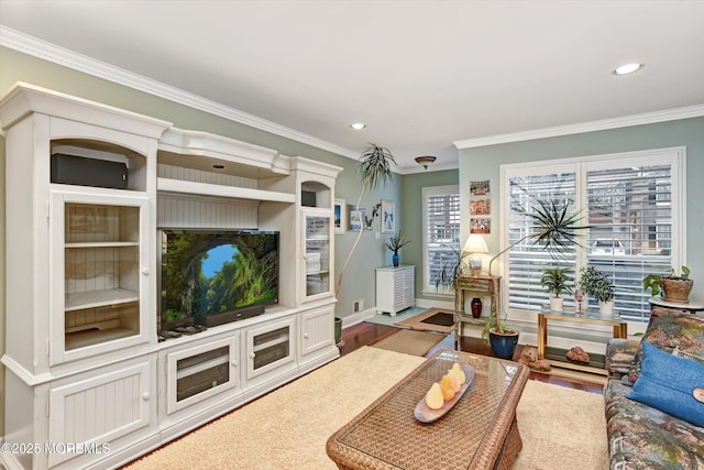 living room featuring hardwood / wood-style flooring and crown molding