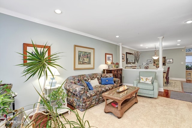 living room featuring crown molding and decorative columns