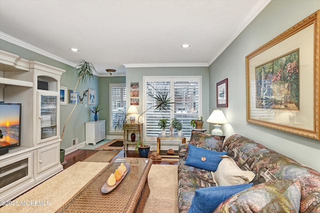 living room with hardwood / wood-style flooring and ornamental molding