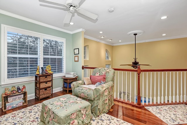 sitting room with crown molding and dark hardwood / wood-style floors