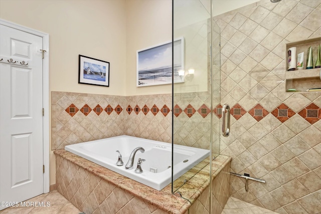 bathroom featuring plus walk in shower and tile patterned flooring