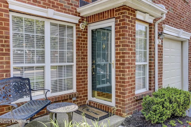 property entrance with a garage