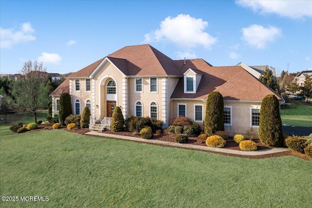 colonial inspired home with a front yard