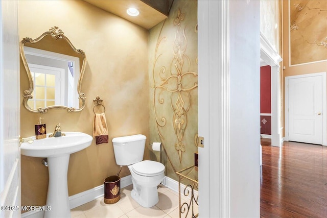 bathroom featuring tile patterned flooring and toilet