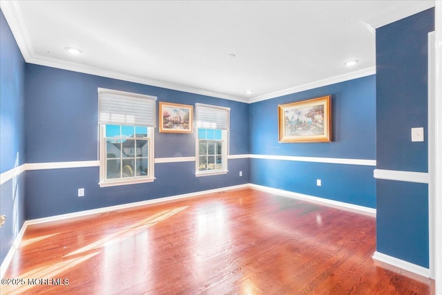 unfurnished room with hardwood / wood-style flooring and crown molding