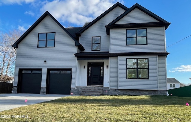 view of front of home featuring a garage and a front yard