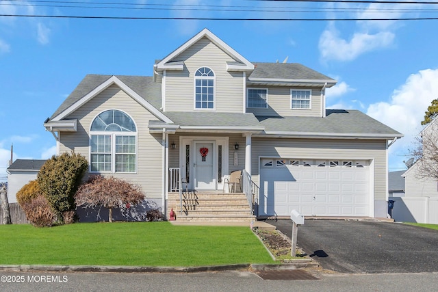 front of property featuring a garage and a front yard