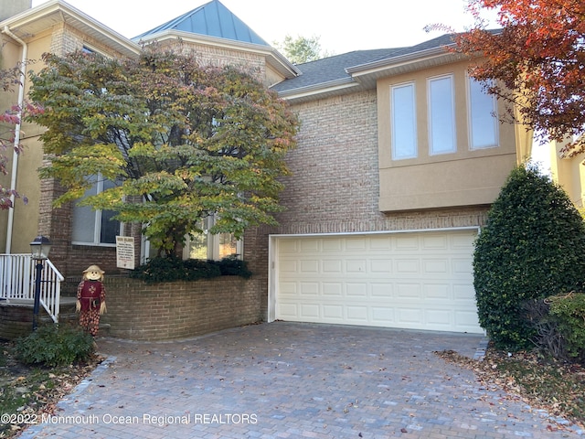 view of front of property with a garage