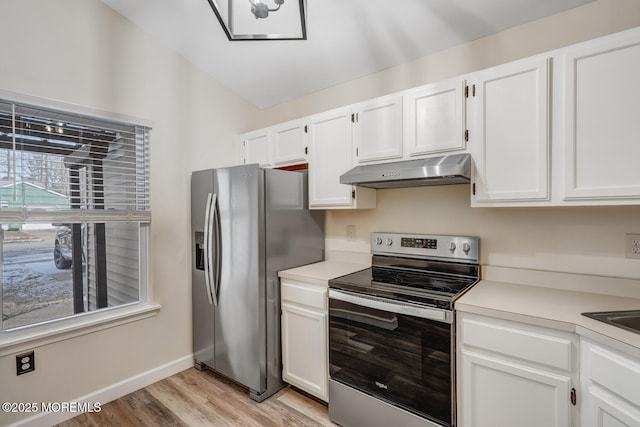 kitchen featuring white cabinetry, a healthy amount of sunlight, stainless steel appliances, and light hardwood / wood-style flooring