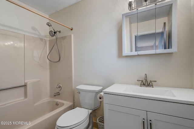 full bathroom with vanity, toilet, and washtub / shower combination