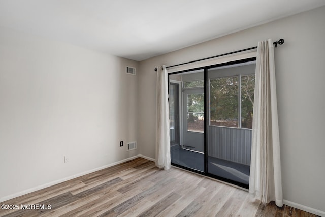 empty room featuring light hardwood / wood-style floors