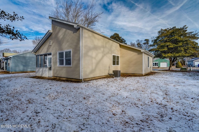 view of snow covered exterior featuring central AC