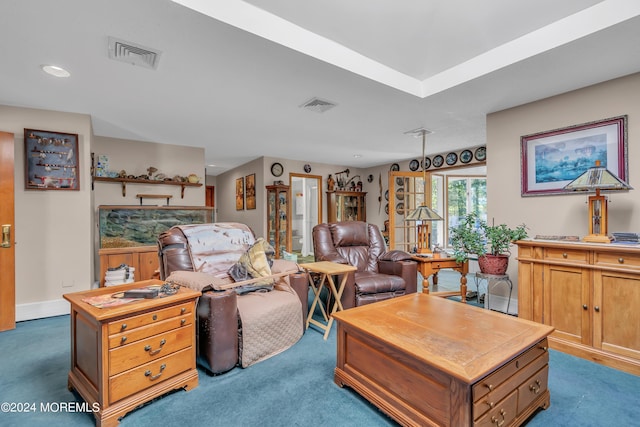 living room with dark colored carpet