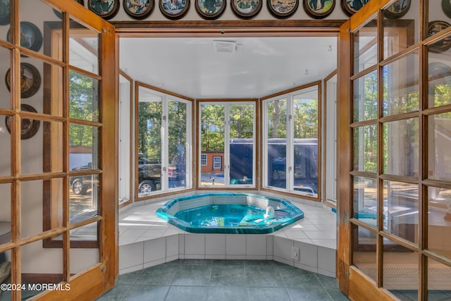 view of pool featuring an indoor hot tub