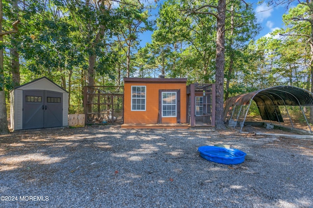 view of outbuilding featuring a carport