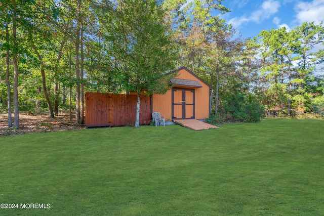 view of outdoor structure with a lawn