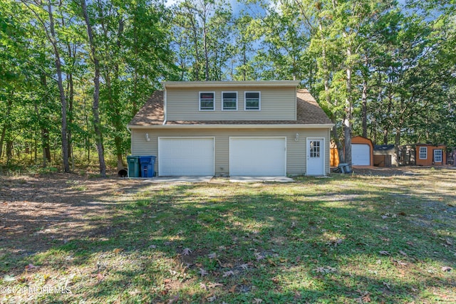 garage featuring a yard