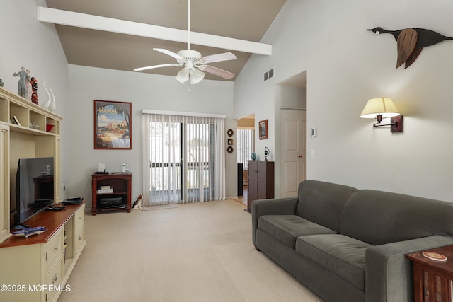 carpeted living room featuring ceiling fan and high vaulted ceiling