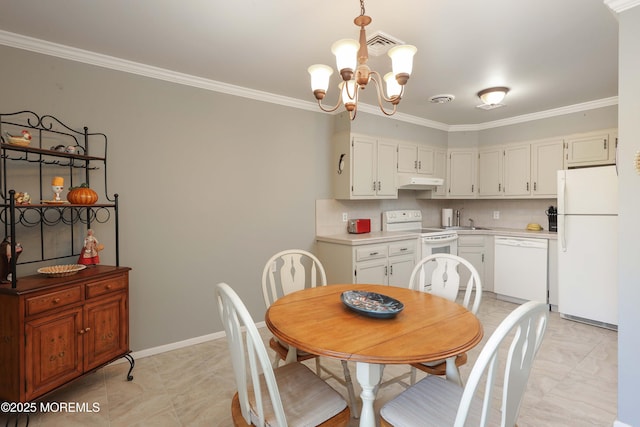 dining area with crown molding and a notable chandelier