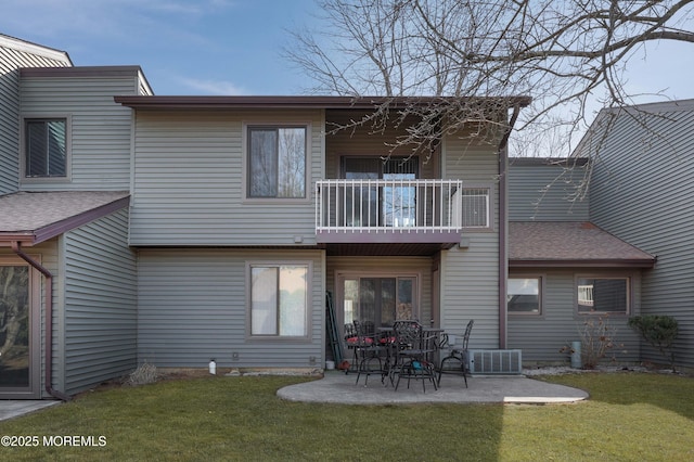 back of house with central AC unit, a yard, a patio area, and a balcony