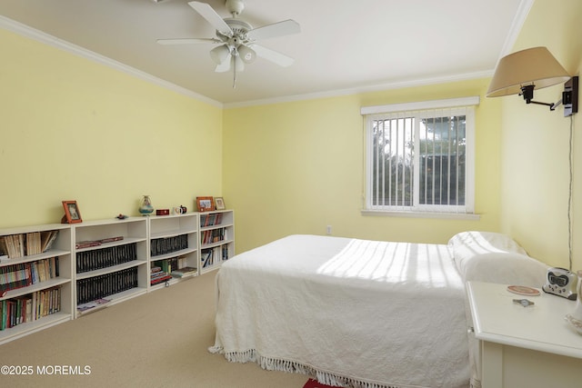 bedroom featuring crown molding, ceiling fan, and carpet floors