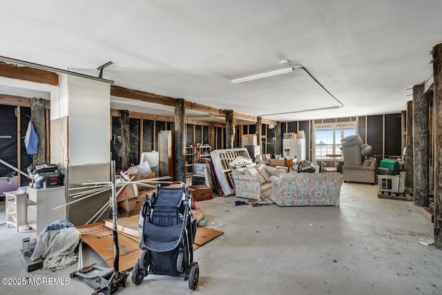 basement featuring white fridge with ice dispenser