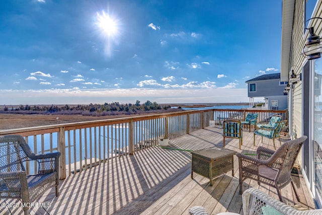 wooden deck with a water view