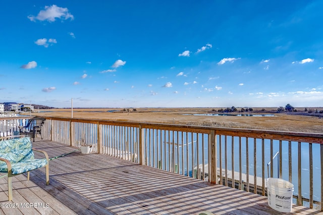 deck featuring a water view