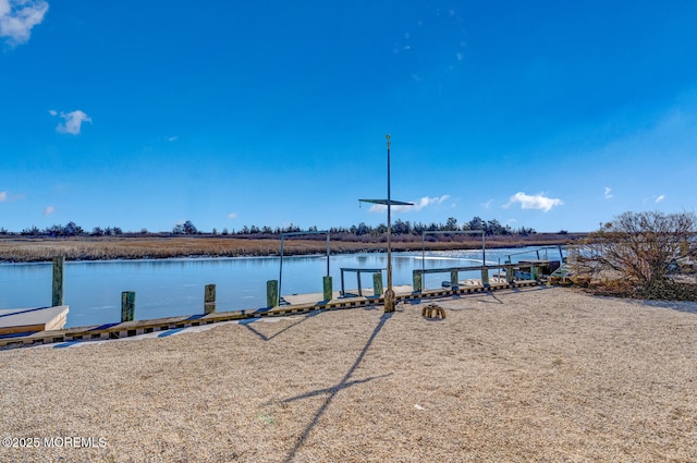 view of water feature with a dock