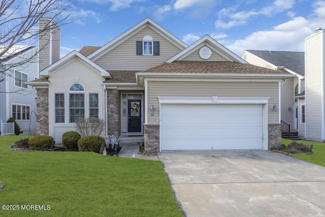 view of front facade with a garage and a front yard