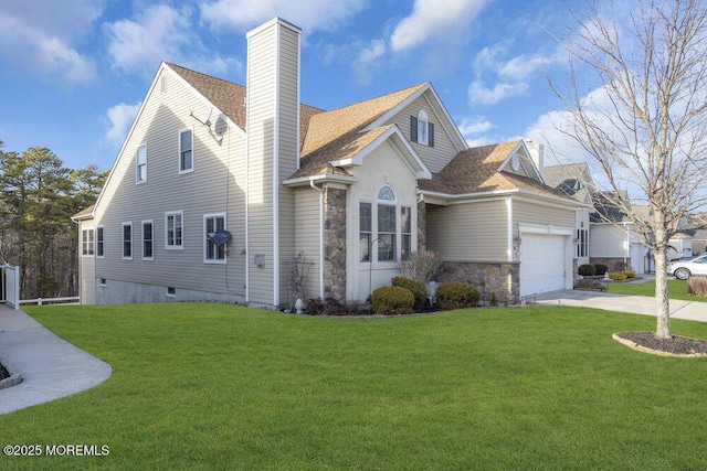 exterior space with a garage and a front lawn