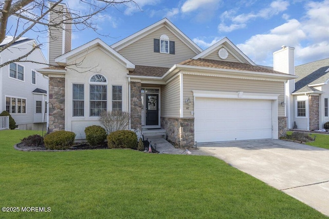 view of front of home with a garage and a front yard