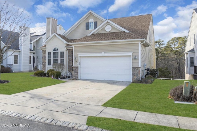 view of front facade featuring a garage and a front lawn