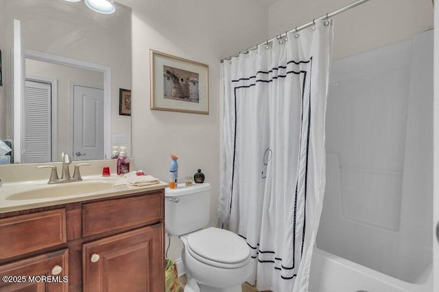 bathroom with vanity, curtained shower, and toilet