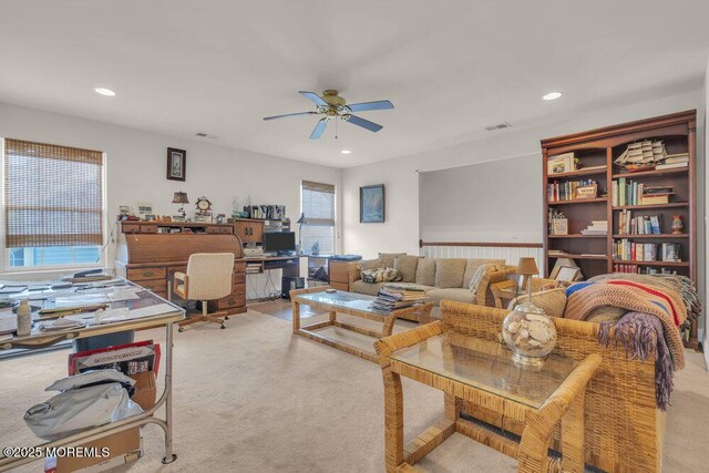 living room with light carpet and ceiling fan