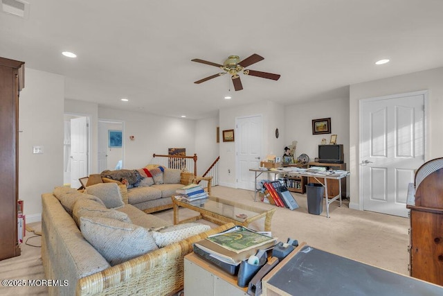 living room with ceiling fan and light colored carpet