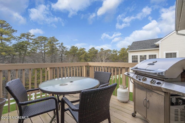 deck featuring a grill