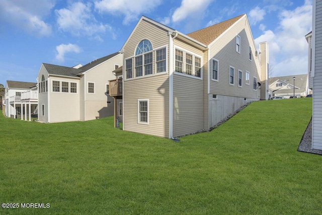 rear view of house with a lawn