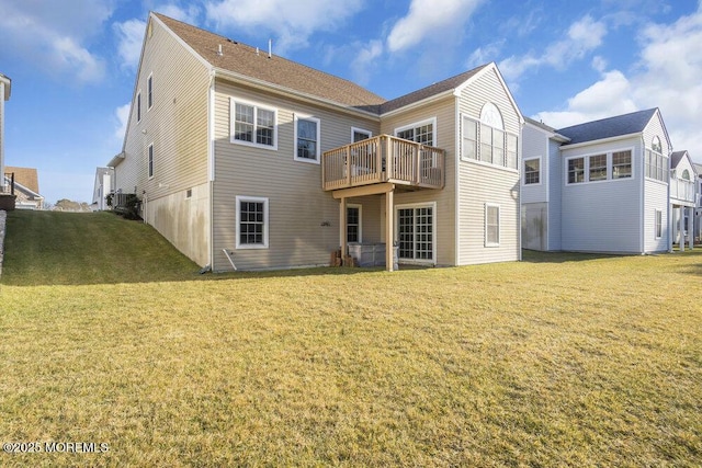 rear view of house featuring central AC, a yard, and a deck