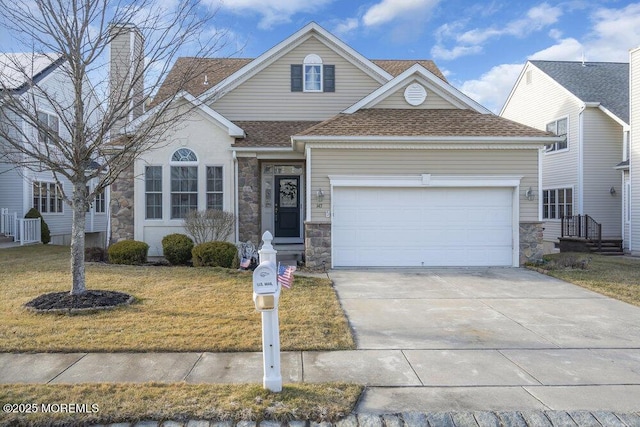 front of property with a garage and a front yard