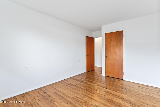 unfurnished room with light hardwood / wood-style flooring