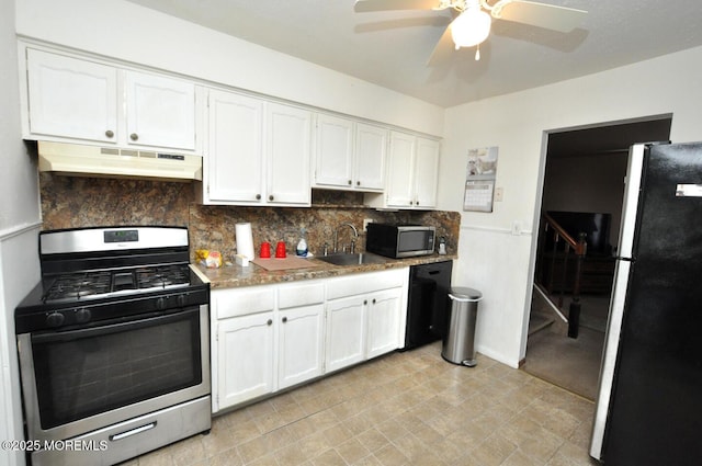 kitchen with white cabinetry, appliances with stainless steel finishes, and decorative backsplash