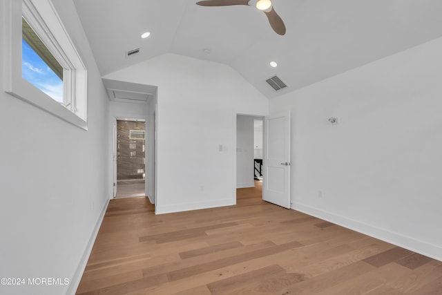 unfurnished bedroom featuring vaulted ceiling, ceiling fan, and light hardwood / wood-style floors