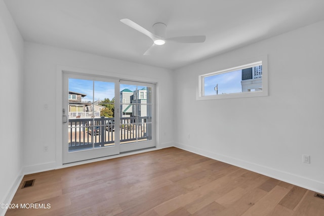 spare room featuring ceiling fan and light hardwood / wood-style floors