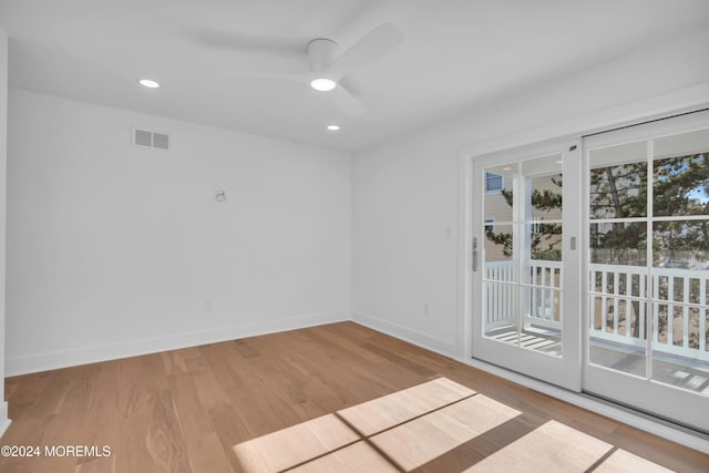 empty room featuring ceiling fan and light wood-type flooring