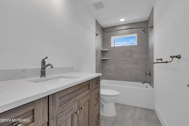 full bathroom featuring vanity, toilet, and tiled shower / bath combo